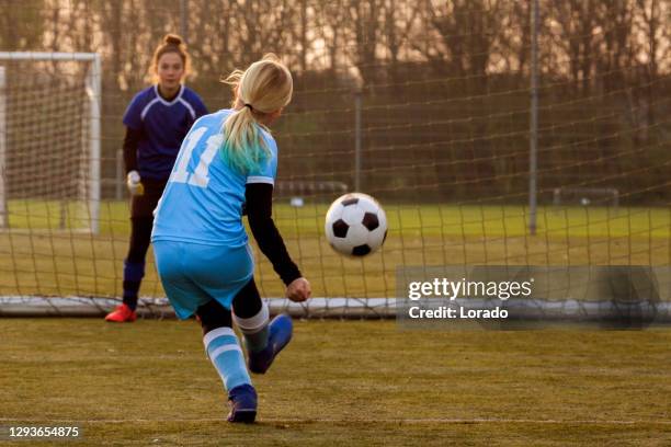 young female soccer girl during football training - soccer team stock pictures, royalty-free photos & images