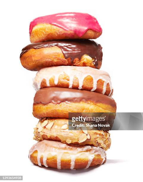 stack of doughnuts - ungesunde ernährung stock-fotos und bilder