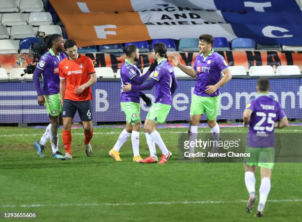 Nahki Wells and Chris Martin of Bristol City celebrate the own goal scored by Sonny Bradley of Luton Town during the Sky Bet Championship match...