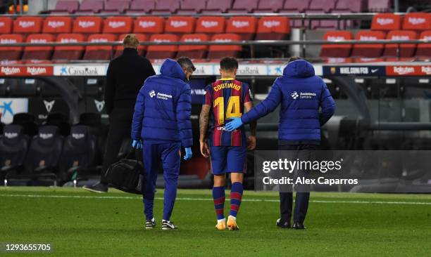 Philippe Coutinho of FC Barcelona leaves the pitch after getting injured during the La Liga Santander match between FC Barcelona and SD Eibar at Camp...