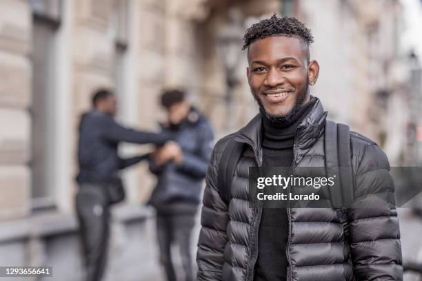 multi ethnic university students going to classes in the netherlands - autumn friends coats stock pictures, royalty-free photos & images