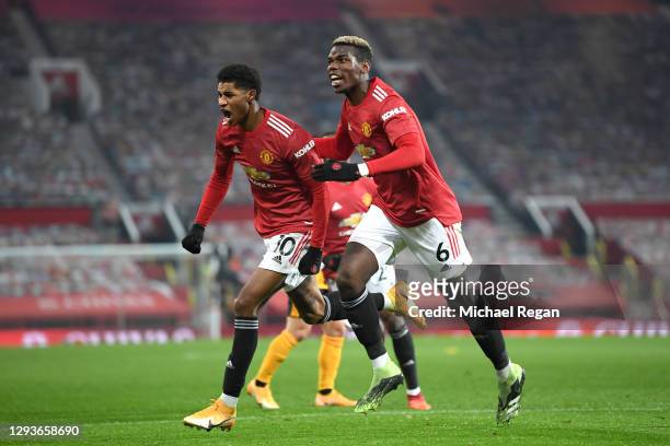 Marcus Rashford of Manchester United celebrates with teammate Paul Pogba after scoring his team's first goal during the Premier League match between...