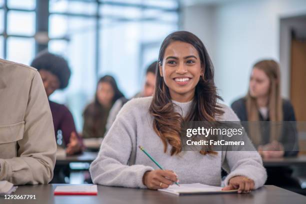 female university student in lecture hall - human gender stock pictures, royalty-free photos & images