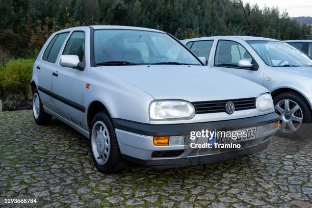 classic volkswagen golf iii on a parking - golf imagens e fotografias de stock