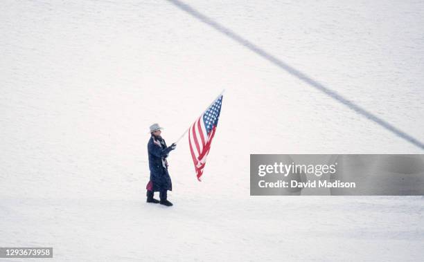 Cammy Myler, a luge athlete from the United States, carries the country's flag during the entry of the teams at the Opening Ceremony of the Winter...