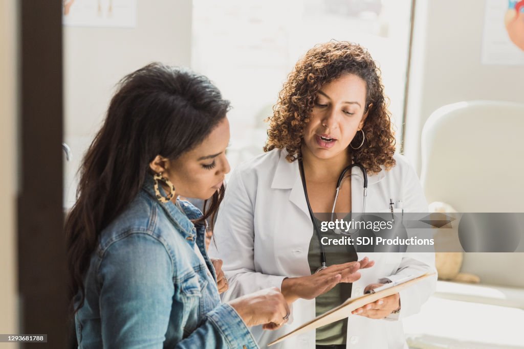 Pediatrician talks with patient's mother