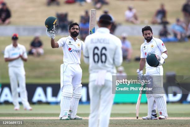 Fawad Alam of Pakistan celebrates his century with Mohammad Rizwan during day five of the First Test match in the series between New Zealand and...