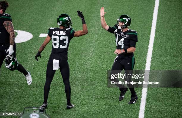 Josh Malone and Sam Darnold of the New York Jets high five during a game against the Denver Broncos at MetLife Stadium on October 1, 2020 in East...