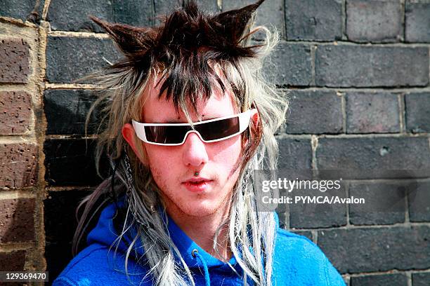 Portrait of a punk boy with a facial hair, wearing sunglasses, Brick Lane, UK 2006