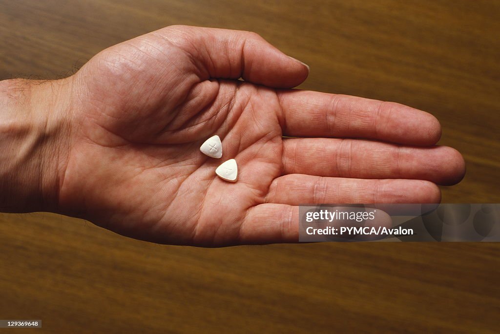 Ecstasy pills in hand