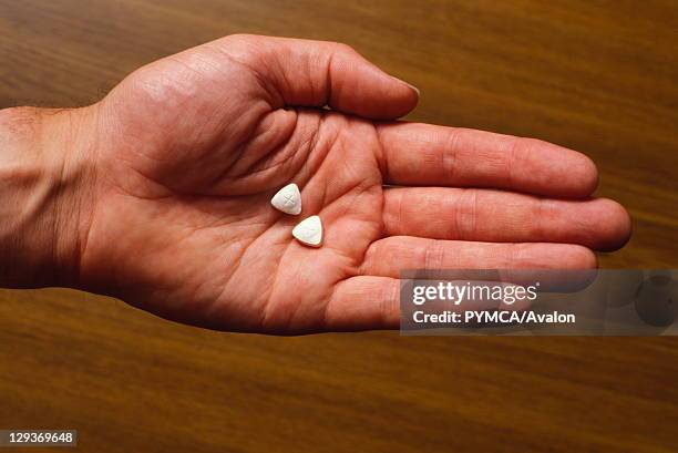 Ecstasy pills in hand