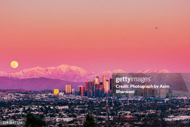 full moon rises over downtown los angeles - mount baldy stock pictures, royalty-free photos & images