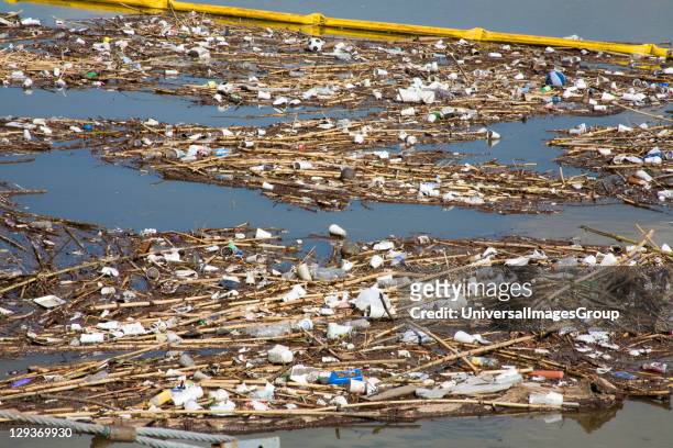 The Garbage boom on the Los Angeles River in Long Beach was built in 2001. Urban runoff carries an assortment of trash and debris from catch basins...