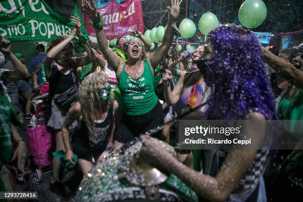 Pro-choice protesters dance outside the National Congress as senators decide on the legalization of abortion on December 30, 2020 in Buenos Aires,...