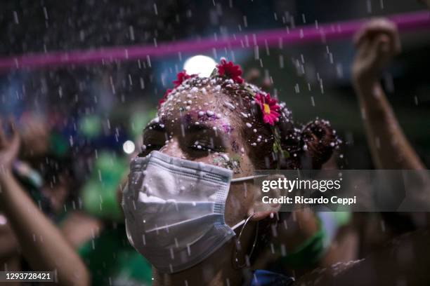 Pro-choice protester waits outside the National Congress as senators decide on the legalization of abortion on December 30, 2020 in Buenos Aires,...