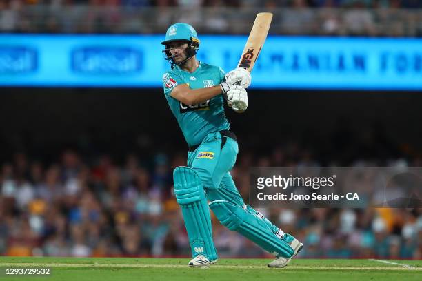 Lewis Gregory of the Heat plays a shot during the Big Bash League match between the Hobart Hurricanes and Brisbane Heat at The Gabba, on December 30...