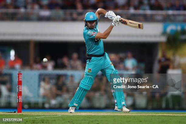 Lewis Gregory of the Heat plays a shot during the Big Bash League match between the Hobart Hurricanes and Brisbane Heat at The Gabba, on December 30...