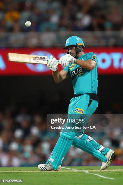 Lewis Gregory of the Heat plays a shot during the Big Bash League match between the Hobart Hurricanes and Brisbane Heat at The Gabba, on December 30...