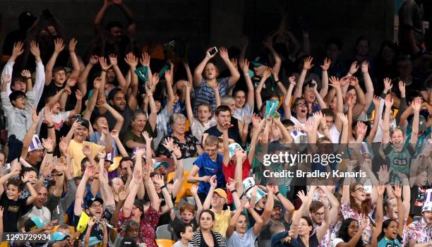 The crowd are seen enjoying themselves during the Big Bash League match between the Hobart Hurricanes and Brisbane Heat at The Gabba, on December 30...