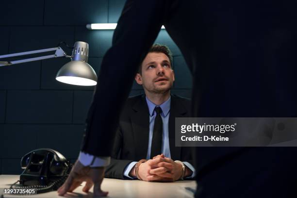 arrested businessman - interrogation stock pictures, royalty-free photos & images