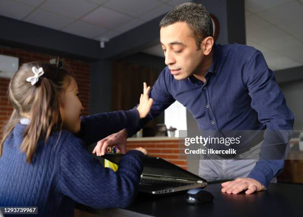 father wants to check what his daughter is doing with laptop computer, parental control concept - video reviewed stock pictures, royalty-free photos & images