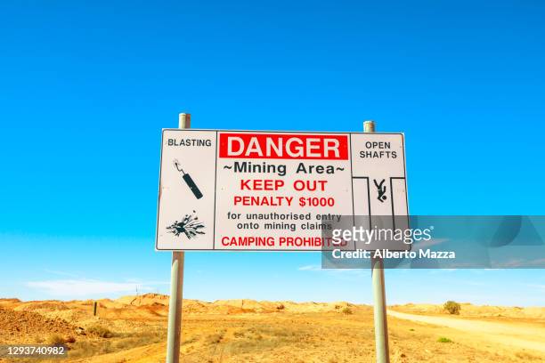 coober pedy danger road sign - opal mining stock pictures, royalty-free photos & images