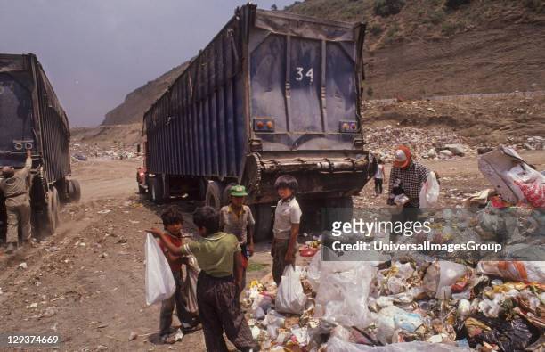 Mexico City, Santa Fe Refuse Dump, Children And Their Parents Work All Day Sifting Rubbish For Items To Sell And Scraps To Eat,