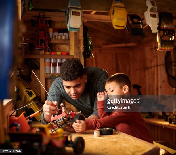 father and son modelmaking - shed stock pictures, royalty-free photos & images
