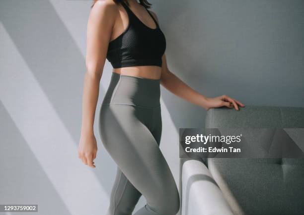 side view mid section of asian chinese woman with yoga pants sport clothing sexual sporty sportive tempting beautiful attractive nice round tight pants leggings - beautiful asian legs stock pictures, royalty-free photos & images