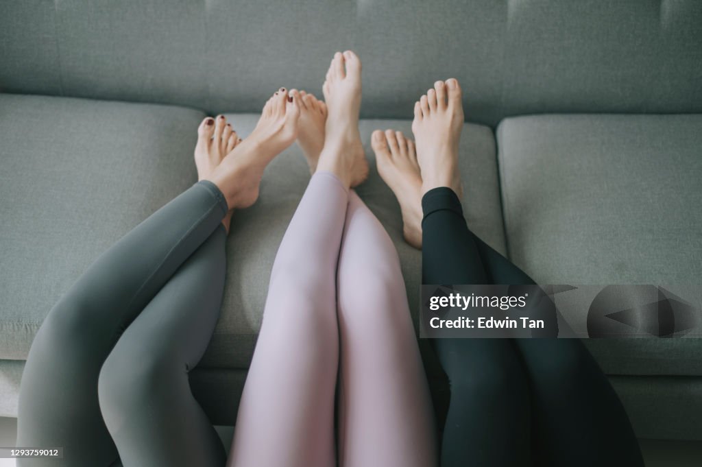 Asian Chinese Legs With Yoga Pants Resting On Sofa Legs Crossed