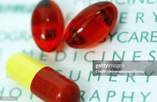 Two red Nurofen capsule and one red and yellow capsule, Nurofen contains ibuprofen which prevents the production of prostaglandins which aid the...