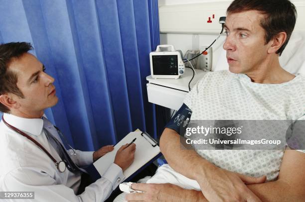 Patient Man 1,794 Male Patient Sitting In A Hospital Bed With Doctor Stock Photos ...