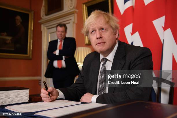 Prime Minister, Boris Johnson poses for photographs after signing the Brexit trade deal with the EU in number 10 Downing Street on December 30, 2020...