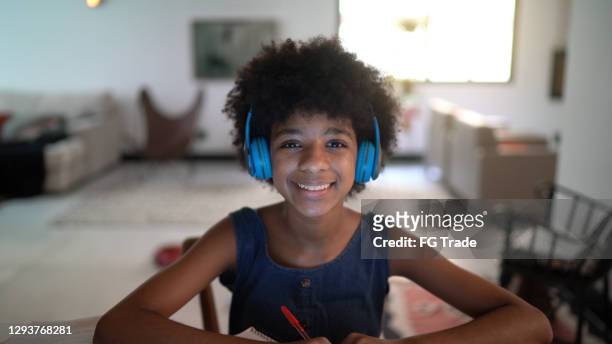teenager girl doing a video call during homeschooling - webcam point of view - 13 year old black girl stock pictures, royalty-free photos & images