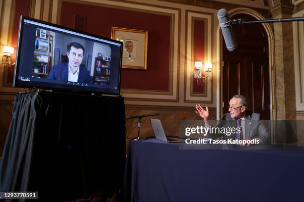 Senate Minority Leader Chuck Schumer talks to Transportation Secretary-Designate Pete Buttigieg on December 30, 2020 in Washington, DC. Pete...