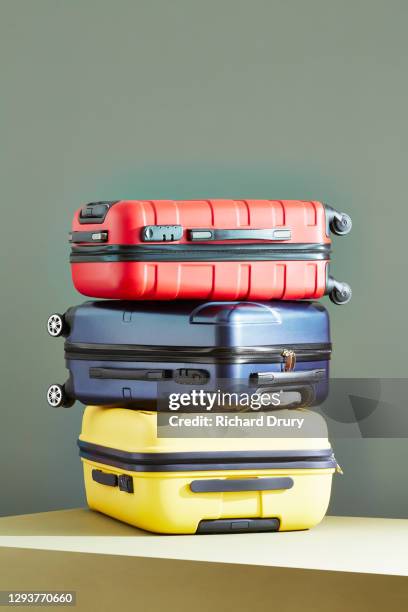 a stack of suitcases - bagage fotografías e imágenes de stock