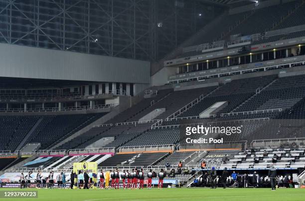 Both sets of players enter the field prior to the Premier League match between Newcastle United and Liverpool at St. James' Park on December 30, 2020...