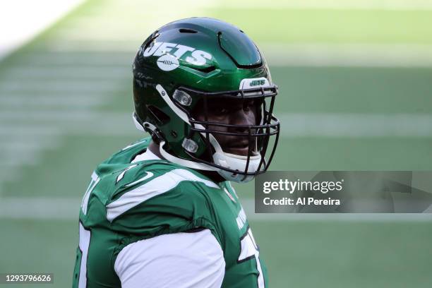 Mekhi Becton of the New York Jets follows the action against the Cleveland Browns at MetLife Stadium on December 27, 2020 in East Rutherford, New...