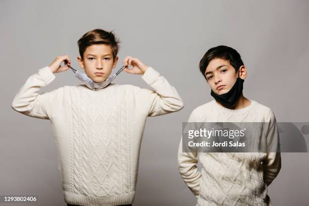 two boys wearing face masks - family photo shoot stock pictures, royalty-free photos & images