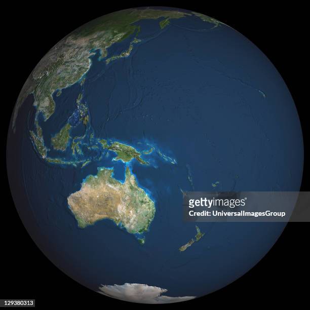 Earth. True colour satellite image of the Earth, centred on the region of Oceania. North is at top. Water is blue, vegetation is green, arid areas...