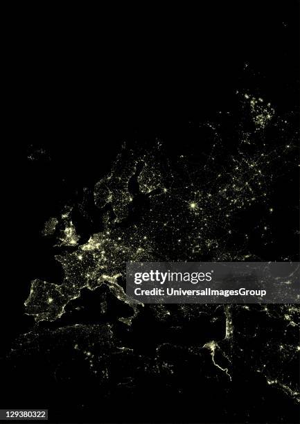 Lights of Western Europe at night from space. Coloured image derived from satellite data showing Western Europe at night. This image is a mosaic of...