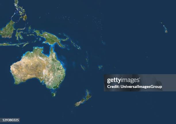 Oceania. True colour satellite image centred on the region of Oceania. North is at top. Water is blue, vegetation is green, and arid areas are brown....