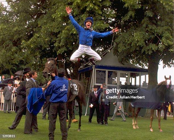 Frankie Dettori leaps off KayfTara after winning the Gold Cup during Royal Ascot week at Ascot racecourse in Berkshire, England. \ Mandatory Credit:...