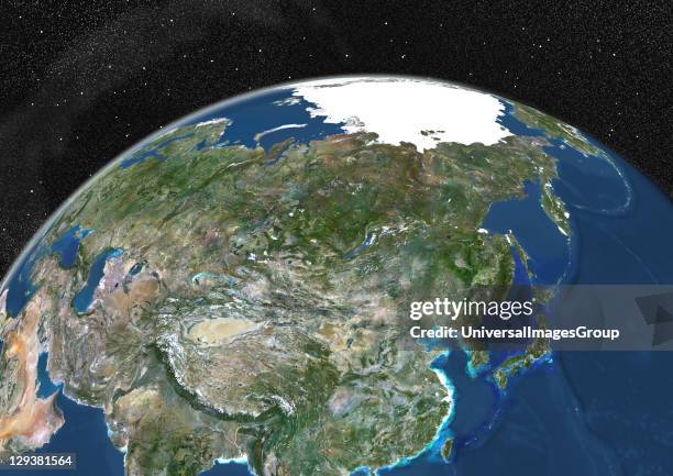 True colour satellite image of the Earth showing Asia and the North Pole. This image in orthographic projection was compiled from data acquired by...