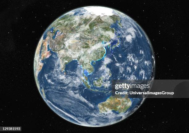 True colour satellite image of the Earth centred on Asia and Oceania with cloud coverage, during summer solstice at 6 a.m GMT. This image in...