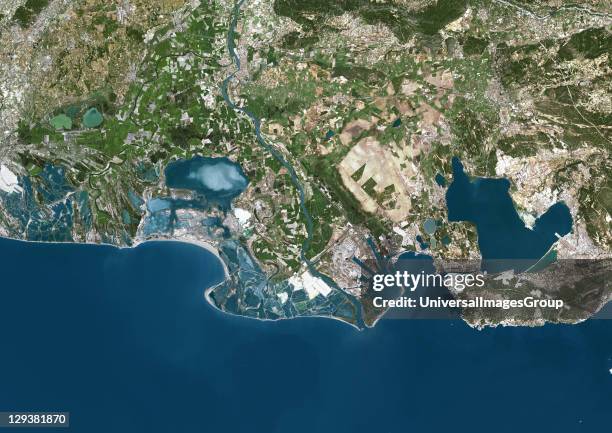 True colour satellite image of the Rhone Delta in southern France. At the city of Arles , the Rhone divides itself in two arms, forming the Camargue...