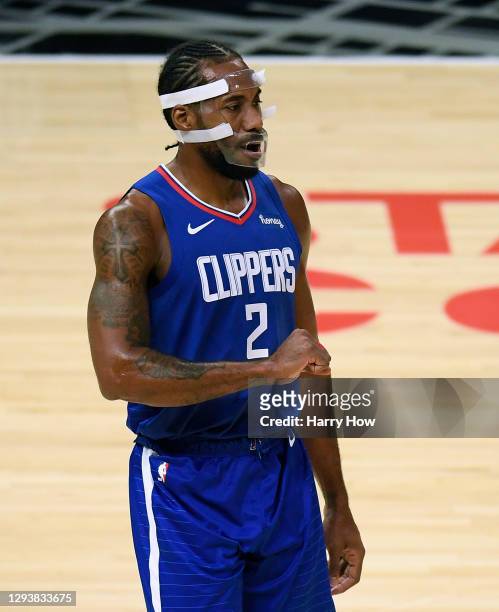 Kawhi Leonard of the LA Clippers wears a face guard during the first half against the Portland Trail Blazers at Staples Center on December 30, 2020...
