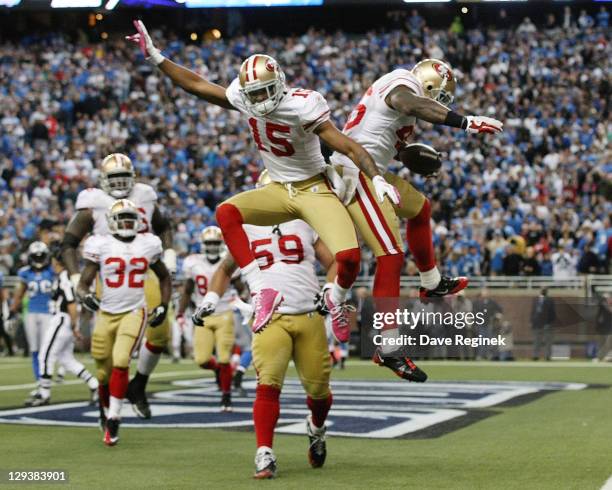 Delanie Walker and Michael Crabtree of the San Francisco 49ers celebrate a touchdown late in the game against the Detroit Lions during a NFL game at...