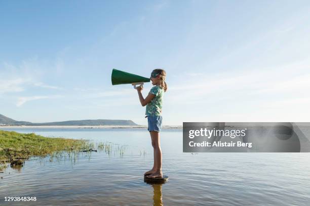 eco warrior superhero shouting into megaphone - acción por el clima fotografías e imágenes de stock