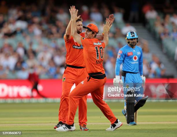 Andrew Tye of the Perth Scorchers and Mitch Marsh of the Perth Scorchers celebrate during the Big Bash League match between the Adelaide Strikers and...